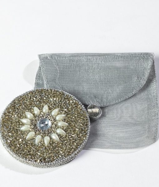 This bead/pearl mirror decorated with sequins and jewels appeals to all.