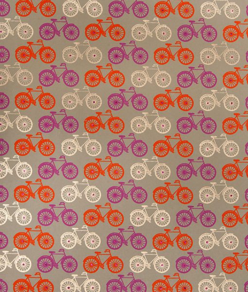 Wrapping paper orange bicycle print is handmade from recycled cotton.