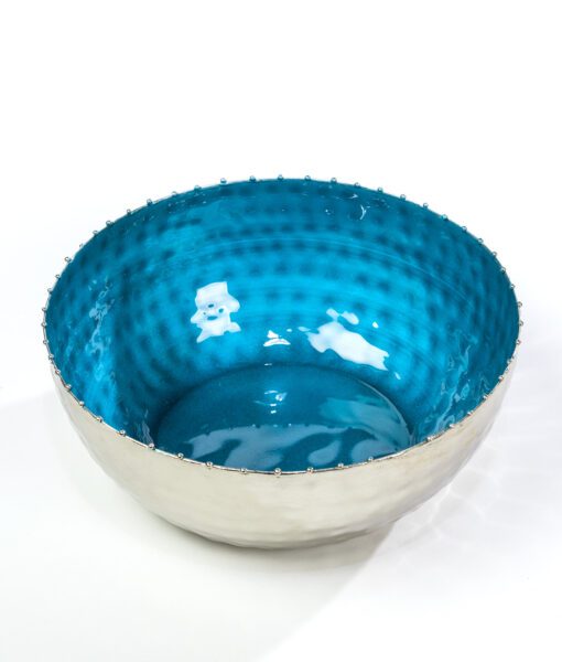 This blue enamel bowl with a beaded edge is the essence of fine dinning.