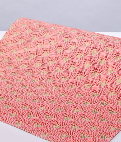 Scallop mosiac orange handmade gift wrap is a lively geometric print.
