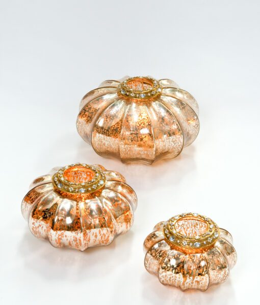 Pumkin tea light holder with its translucent glaze twinkles when candle is lit.
